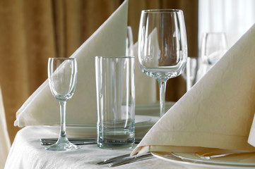 catering table set service with silverware, napkin and glass at restaurant before party