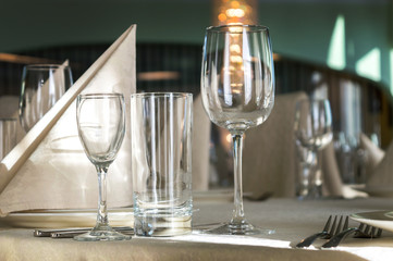 catering table set service with silverware, napkin and glass at restaurant before party
