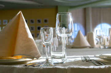 catering table set service with silverware, napkin and glass at restaurant before party
