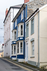 Vertical shot of painted houses in Cardigan Wales, UK