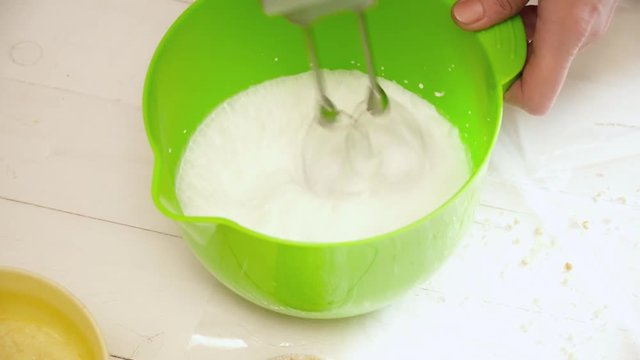 Woman's hands prepering the cream for the eclairs