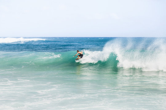 Surfer surfing in ocean