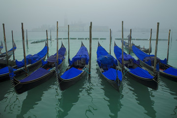 Venetian canal with gondolas,Venice,Italy