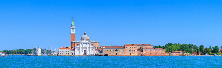 Fototapeta na wymiar Panoramic view of the San Giorgio Maggiore island, the church and monastery at San Giorgio Maggiore in the lagoon in Venice, Italy.