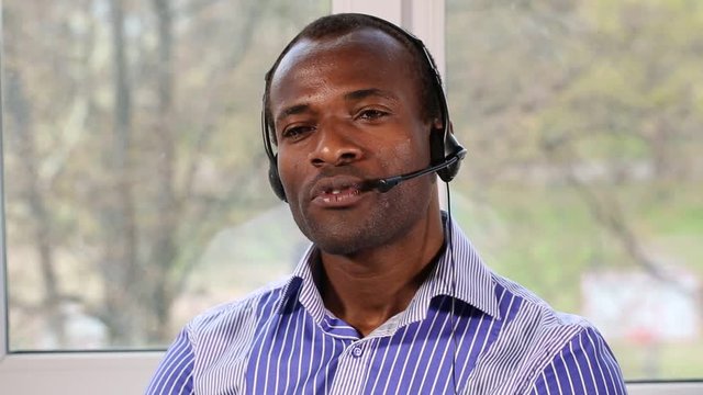 Call Center Advises. The call center operator conducts consultations. He answers questions from clients. This video was shot using Canon 5d Mark 3.