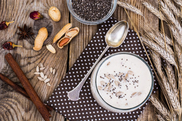 Fototapeta na wymiar Creamy yoghurt with chia, sunflower seeds and nuts