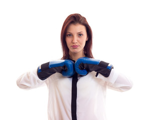 Young businesswoman in boxing gloves