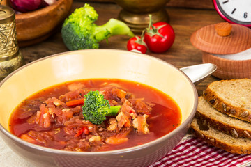 Vegetarian vegetable soup with beet, broccoli and tomatoes