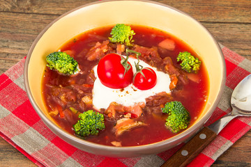 Vegetarian vegetable soup with beet, broccoli and tomatoes