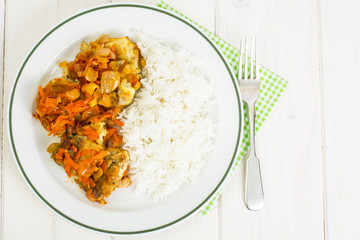 Greek baked fish with carrot, onion and rice