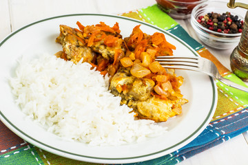 Greek baked fish with carrot, onion and rice