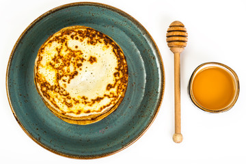 Thin fragrant pancakes on white background