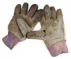 Pair of dirty used gardening gloves. Isolated.