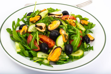 Seafood salad with mussels and arugula