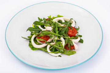 Cooked squid, fresh arugula, tomatoes, oil, spices