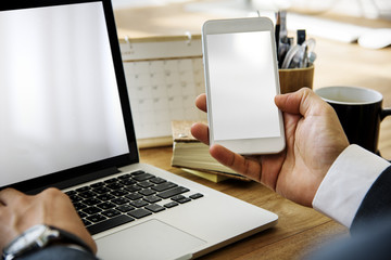 Businessman Working Hold Phone On A Wooden Table