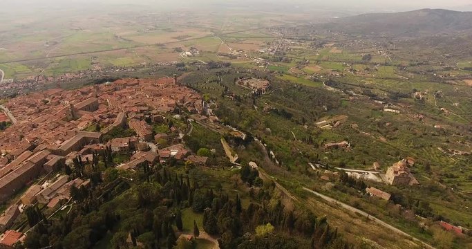 Aerial shot, basilica di Santa Margherita and Medici fortress of Girifalco at Cortona in Tuscany, Italy, 4K