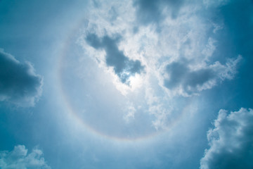Sun halo in the cloudy sky