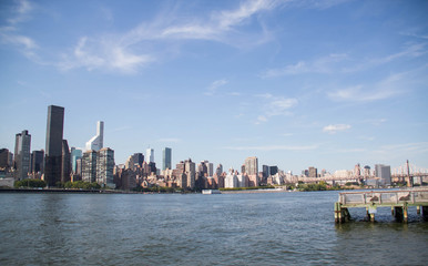 Fototapeta na wymiar Buildings in Manhattan and the river with blue sky, New York