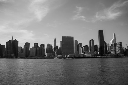 Buildings in Manhattan and the river in black and white style, New York