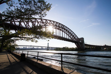The Hell Gate Bridge and Triborough bridge with the sun, Astoria park, New York