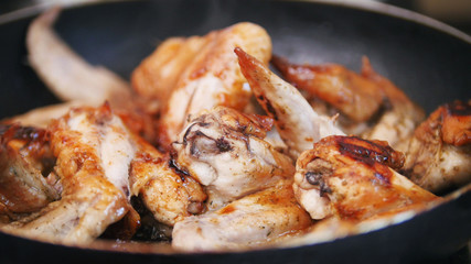 Home junk food - Frying Chicken wings preparing in boiling oil
