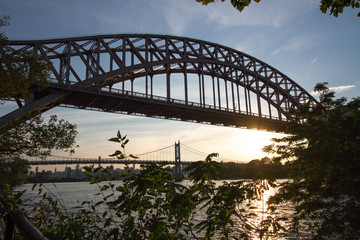 Hell Gate Bridge and Triborough bridge over the river before sunset, New York