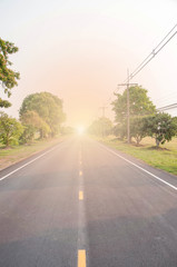 Straight road. The road is straight and trees on either side. Light At The End.  Background.