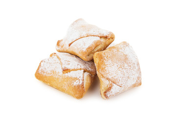 Cookies of puff pastry topped with powdered sugar isolated on white
