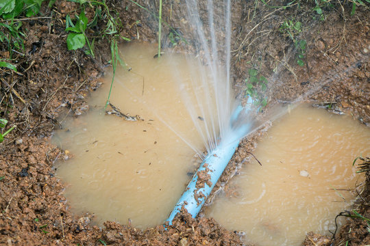 Water pipe break,  leaking from hole in a hose,selective focus