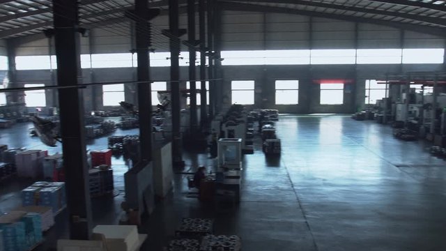 WIDE RL PAN shot of a modern clean factory interior. 4K UHD