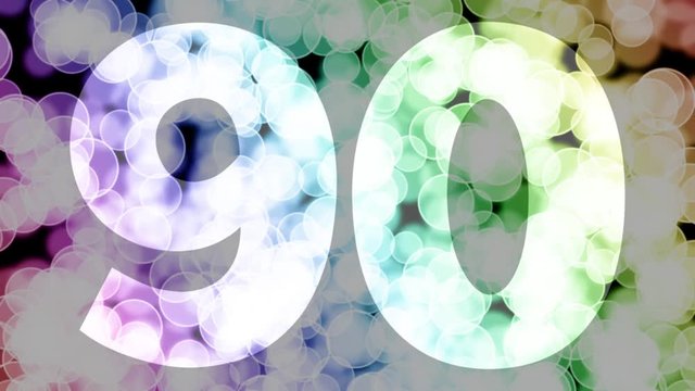 Ninety to ninety one years birthday fade in/out animation with color gradient moving bokeh background. Animation: 90 frames still with number, 180 fade out, 30 clear, 180 fade in, 300 still.