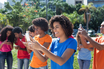 Group of man and woman using the internet with phone