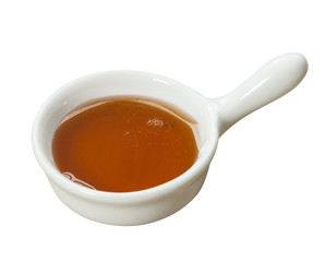 Small pot of honey. Isolated on white background