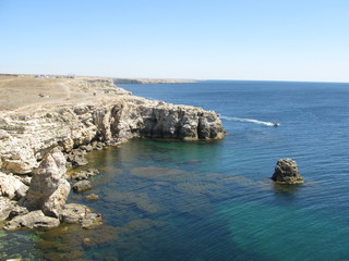 Fototapeta premium Sea, boats, fishermen, beautiful scenery, corals, waves, rocks, seaweed
