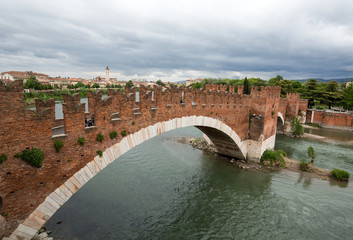 Naklejka premium The Ponte Pietra (Stone Bridge), once known as the Pons Marmoreus, is a Roman arch bridge crossing the Adige River in Verona, Italy. The bridge was completed in 100 BC,