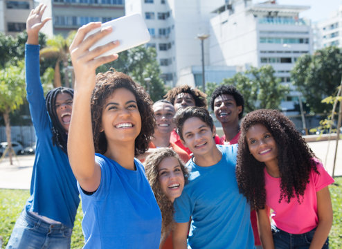 Large Group Of Latin And Caucasian And African American Woman And Man Taking Selfie