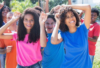 Group of happy dancing hispanic and latin and african american people