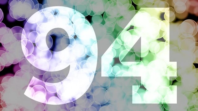 Ninety four to ninety five years birthday fade in/out animation with color gradient moving bokeh background. Animation: 90 frames still with number, 180 fade out, 30 clear, 180 fade in, 300 still.