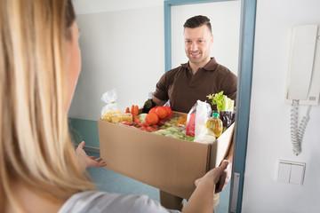 Delivery Man Holding Groceries