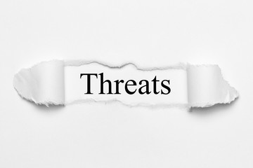 Threats on white torn paper