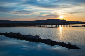 Sunset on old Saline - Salt production field with beautiful sunset - sea landscape