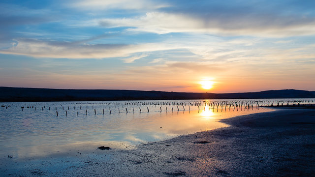 Antique Saline with beautiful sunrise - sea landscape - Salt production field © tanja_g