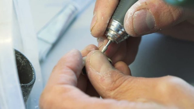 Closeup of making teeth crowns in dental lab