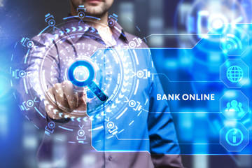 Business, Technology, Internet and network concept. Young businessman working on a virtual screen of the future and sees the inscription: Bank online