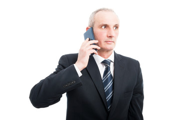 Portrait of senior elegant man talking at phone