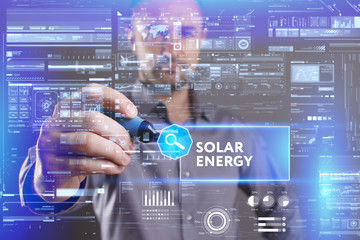 Business, Technology, Internet and network concept. Young businessman working on a virtual screen of the future and sees the inscription: Solar energy