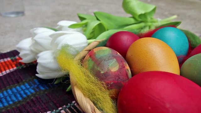     Close up of colorful painted easter eggs in a bascet - hd video