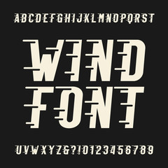 Wind alphabet vector font. Oblique type letters and numbers. Vintage vector typeface for for headlines, posters, logos etc.
