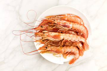 Raw shrimps on plate with copyspace